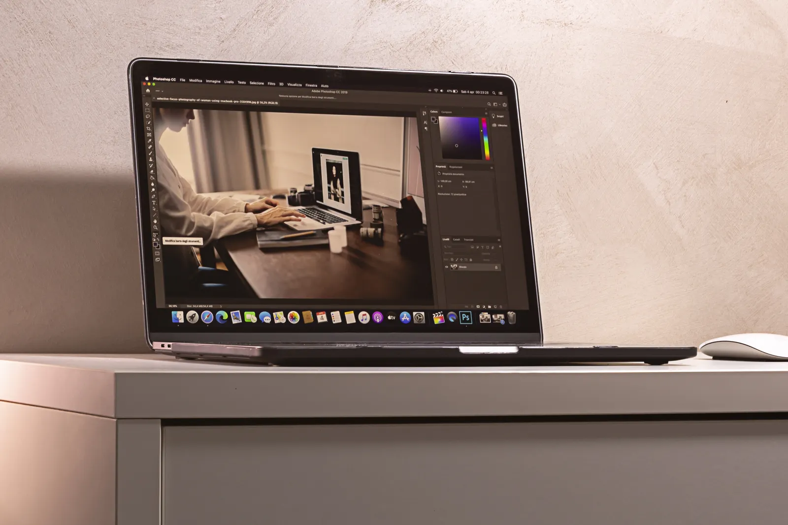 Two slim laptops open side by side on a desk